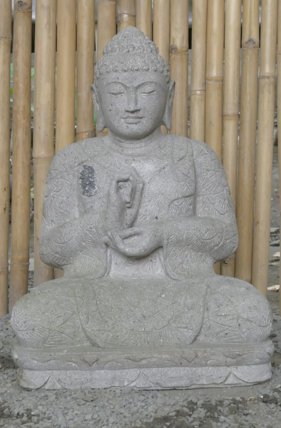  Product image 2 of the product “Seated Buddha with floral carving, Dharmacakra position. 67 cm height. Natural stone (river stone), stonemasonry. There is a stone eye in the chest. ”